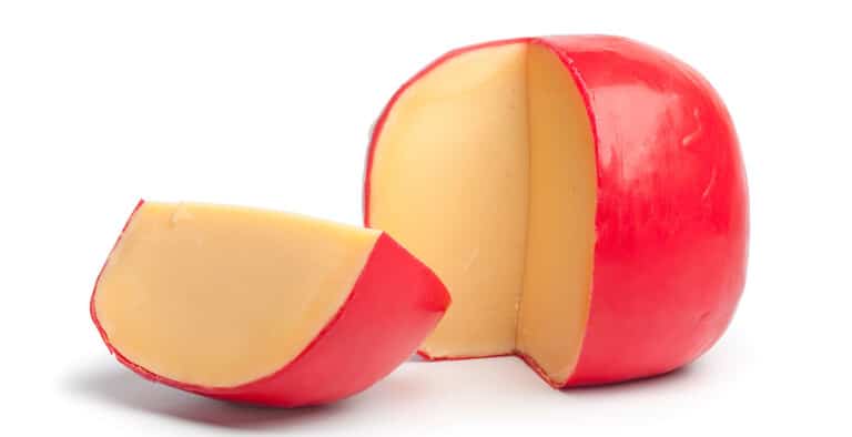  A mold of Edam cheese with a piece cut out of it